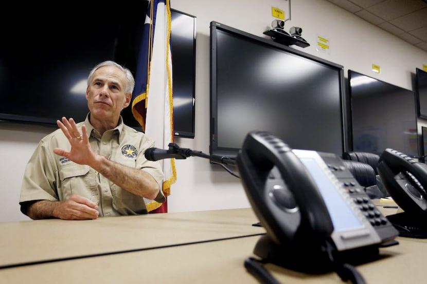 Texas Gov. Greg Abbott meets with the media after briefings with emergency officials during...
