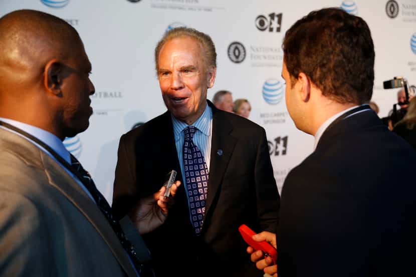 Roger Staubach talks to media during National Football Foundation Hall of Fame event at Omni...