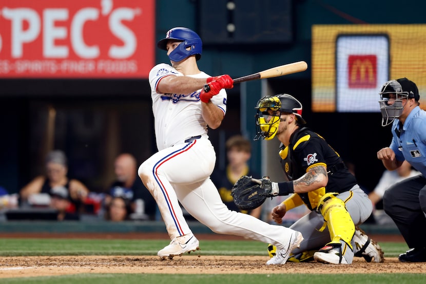 Texas Rangers left fielder Wyatt Langford (36) hits a walk-off single to score third baseman...