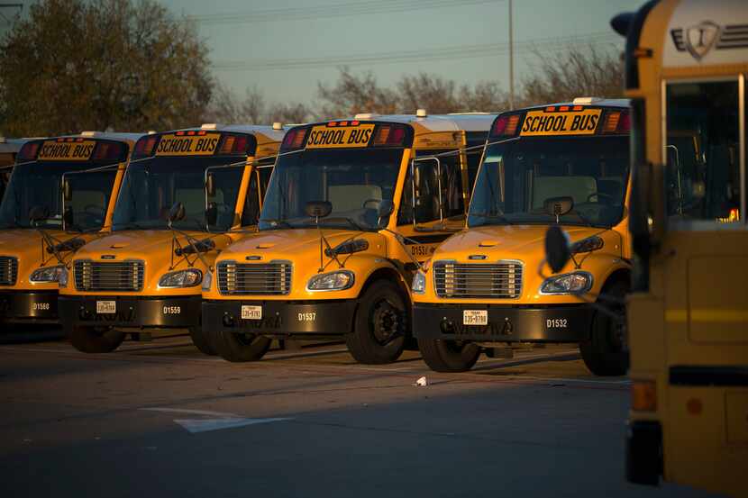 Dallas Independent School District school buses parked at the district's bus lot