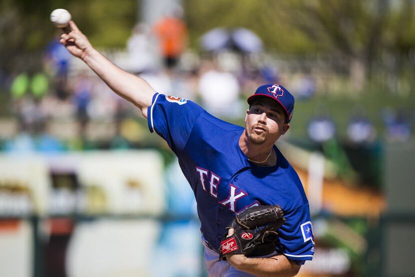 Texas Rangers pitcher Chi Chi Gonzalez pitches during the first inning against the Los...