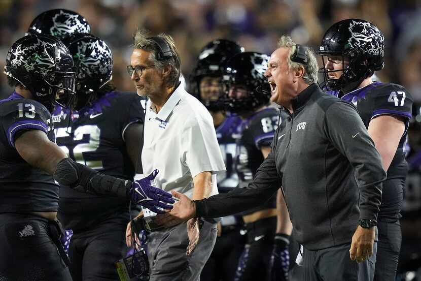 TCU head coach Sonny Dykes celebrates with linebacker Dee Winters (13) after a TCU...