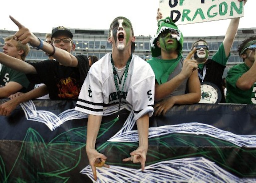 ORG XMIT: *S19186912*  Rabid Southlake Carroll fan Ted Schmidt (center) joins,  Jonathan...