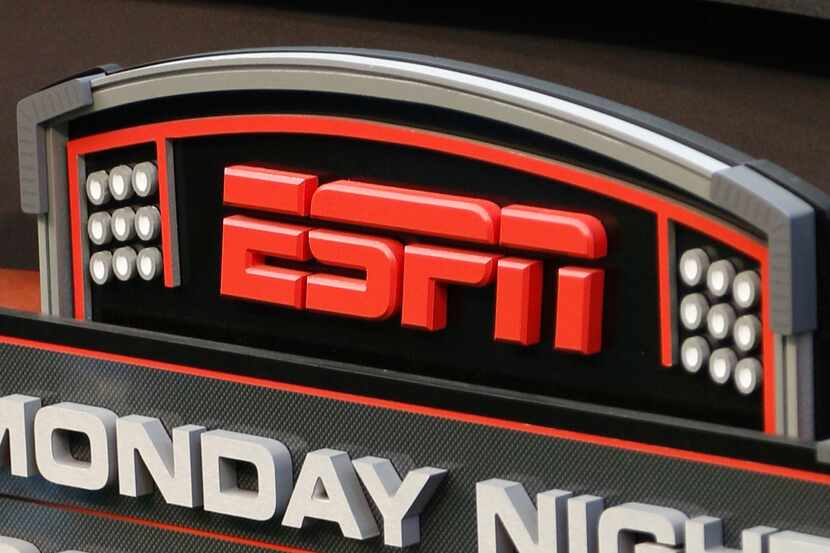 This Sept. 16, 2013, file photo shows the ESPN logo prior to an NFL football game between...