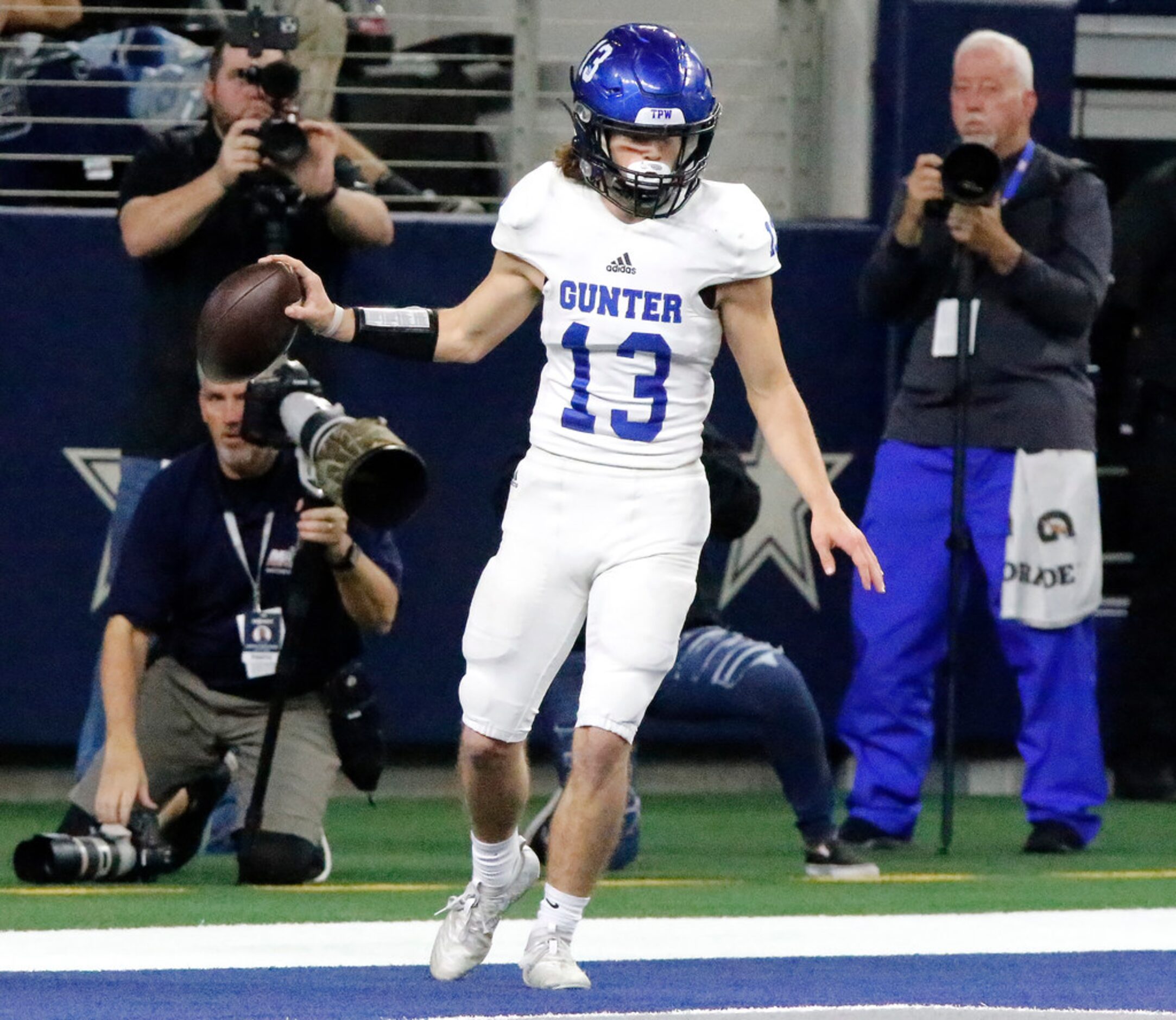 Gunter High School wide receiver Clayton Reed (13) scores the first touchdown of the game...