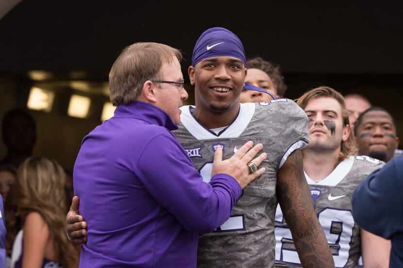 Nov 14, 2015; Fort Worth, TX, USA; TCU Horned Frogs head coach Gary Patterson talks with...