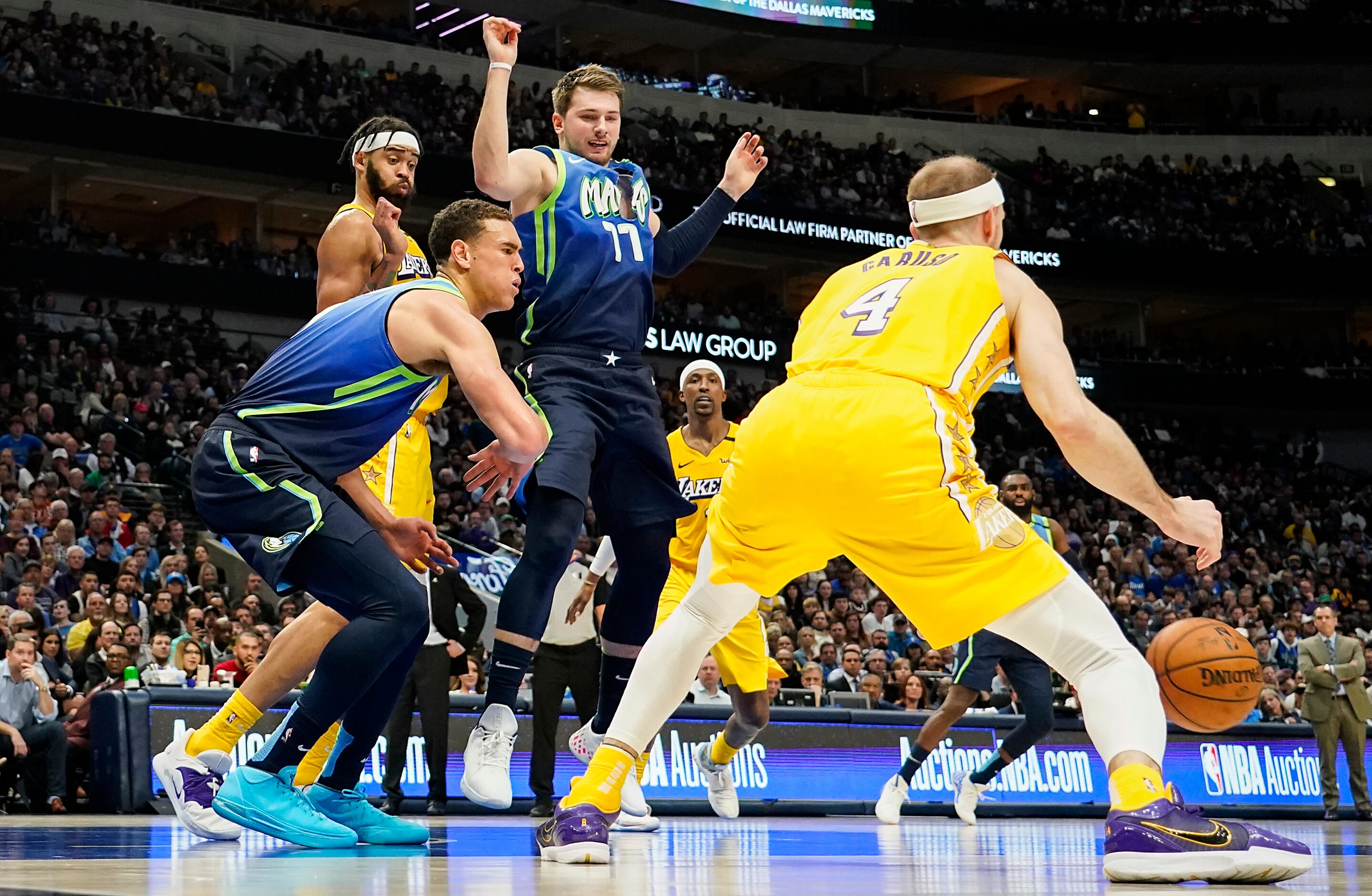 Dallas Mavericks guard Luka Doncic (77) plays with a ripped jersey late in the during second...