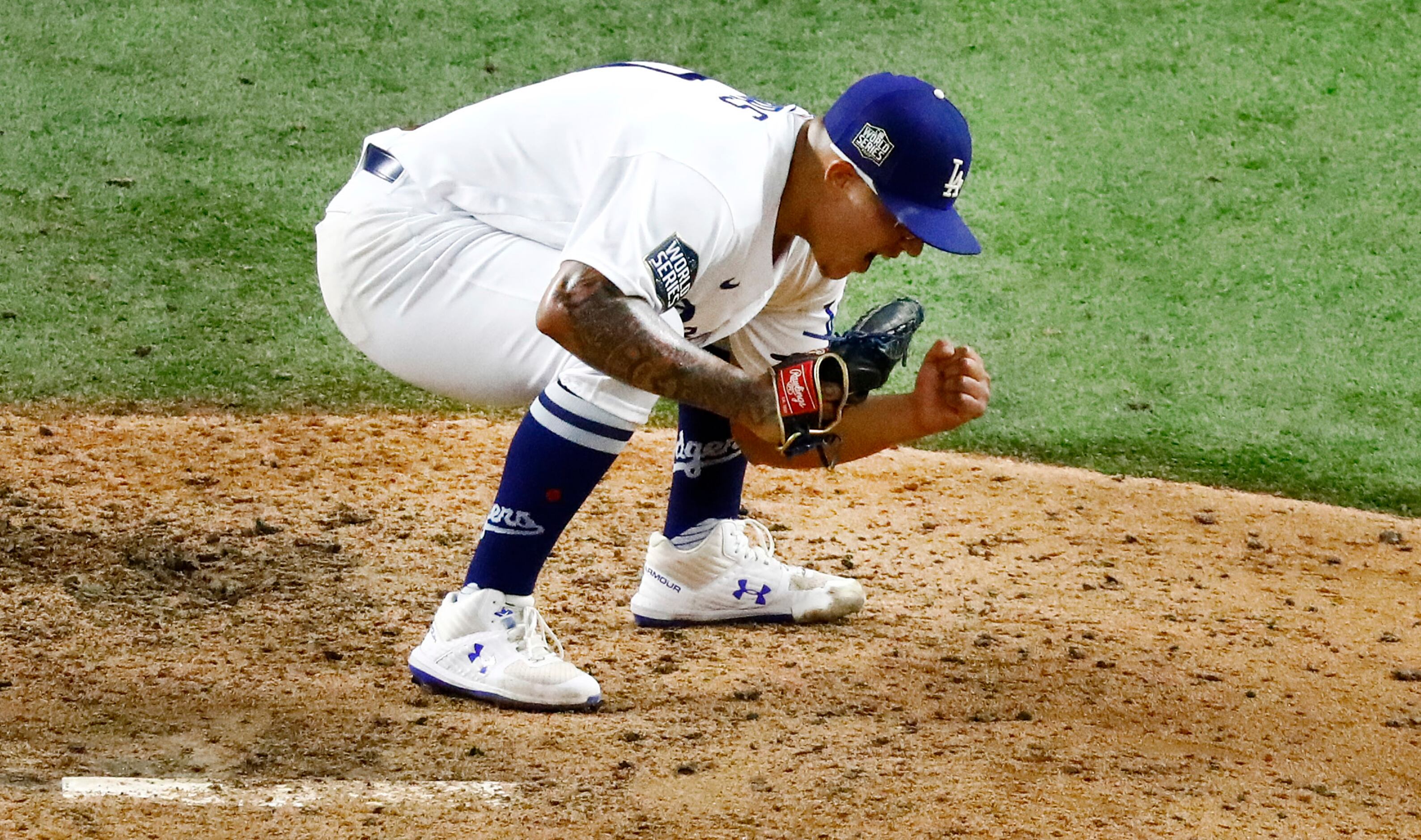 Los Angeles Dodgers relief pitcher Julio Urias (7) reacts after striking out Tampa Bay Rays...