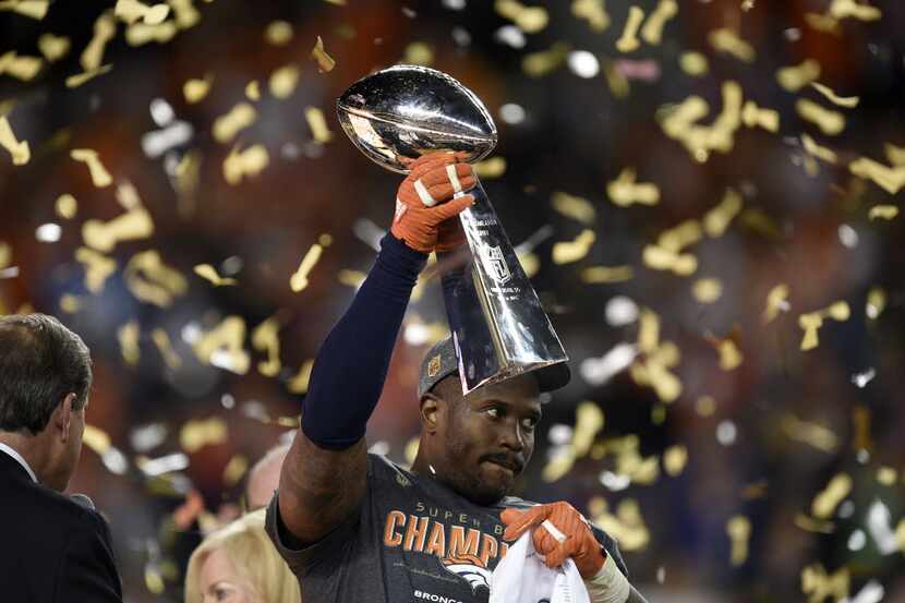 The game's Most Valuable Player, Denver Broncos linebacker Von Miller, celebrates as he...