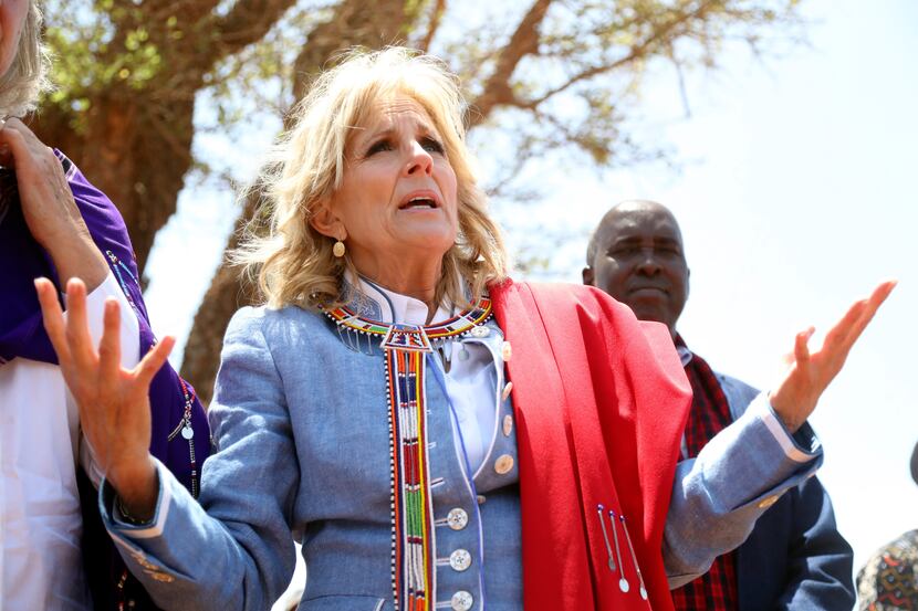 First lady Jill Biden greets women of the Maasai community as they explain the drought...
