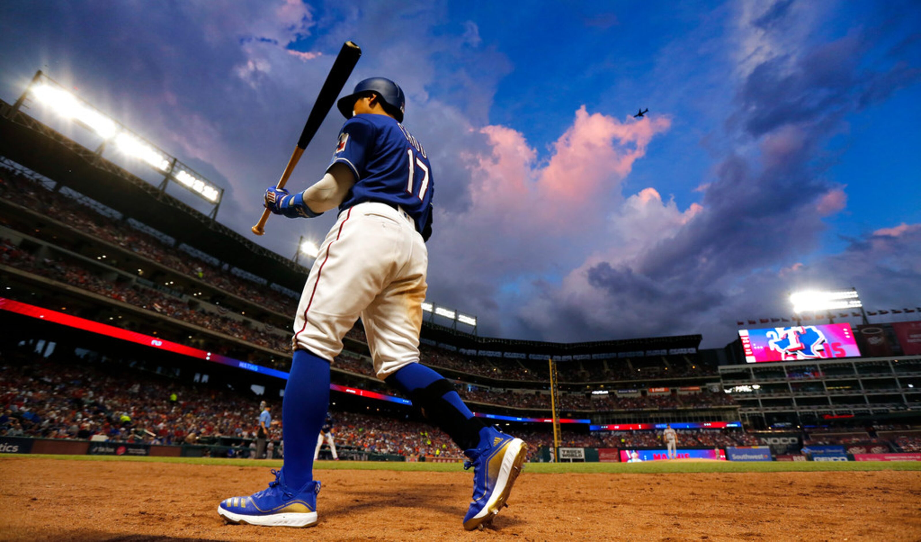 Texas Rangers left fielder Shin-Soo Choo (17) leads off against the Houston Astros rain...