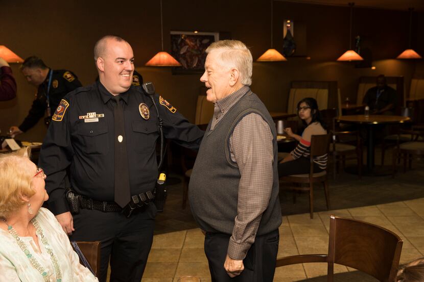 UTA police Officer Garry Douthitt chats with James Gamble during a ceremony at the...