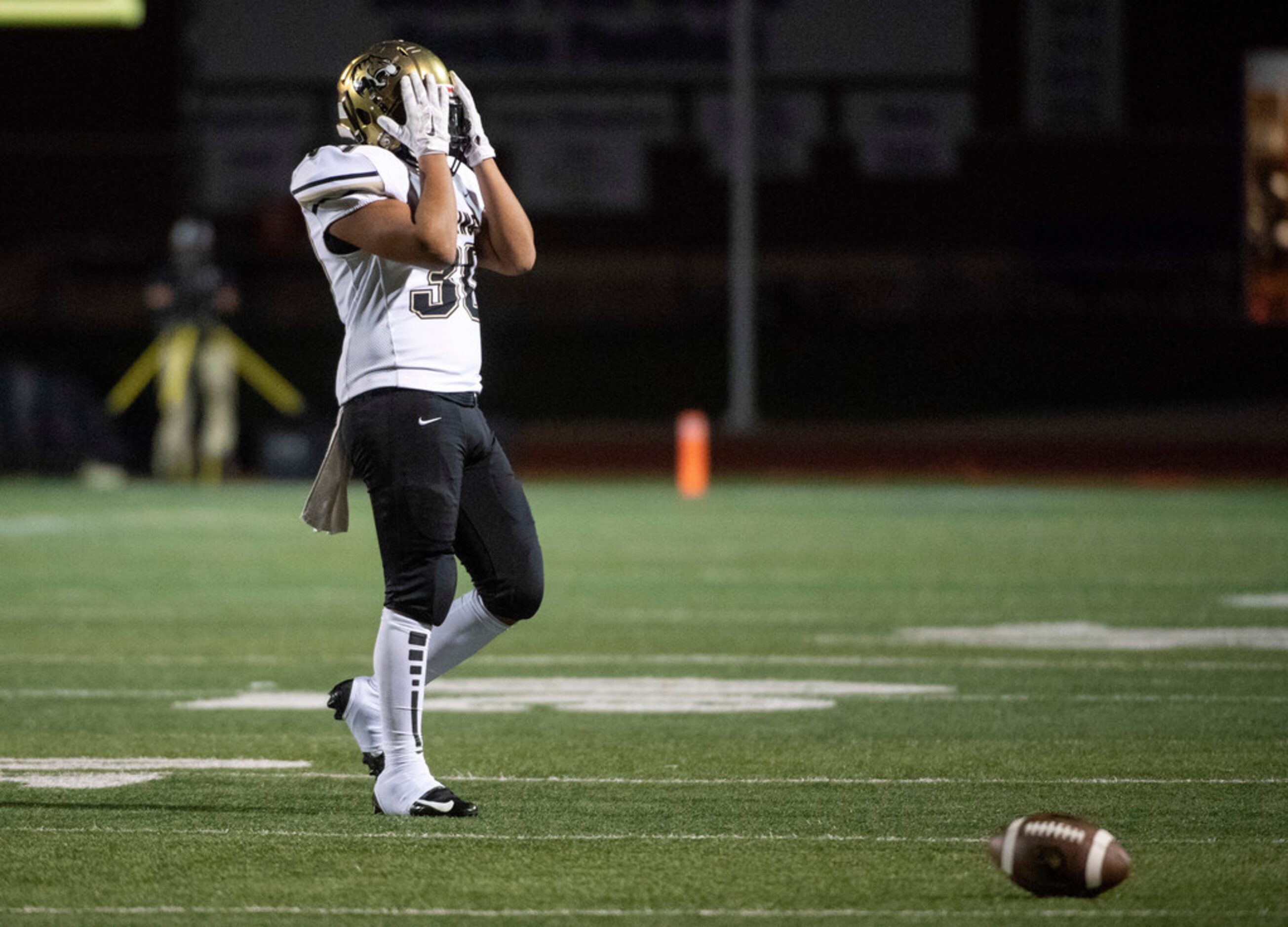 Hebron senior linebacker Jonathan McHenry (41) celebrates a sack with junior defensive end...