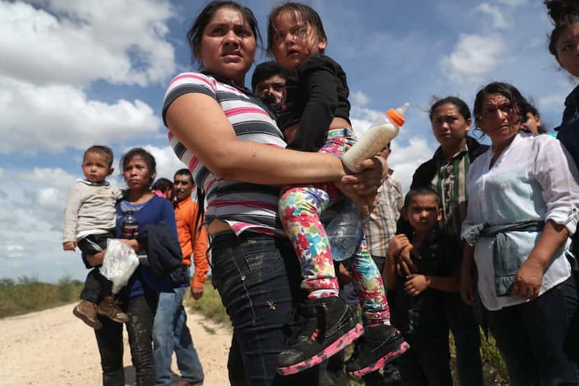 Immigrants from Central America await transport from the U.S. Border Patrol in 2016. Central...