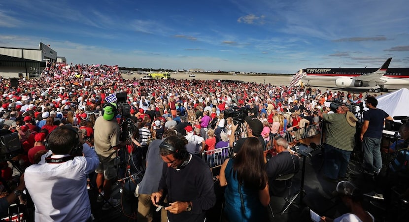 Supportes cheer for Republican presidential candidate Donald Trump at a campaign rally on...