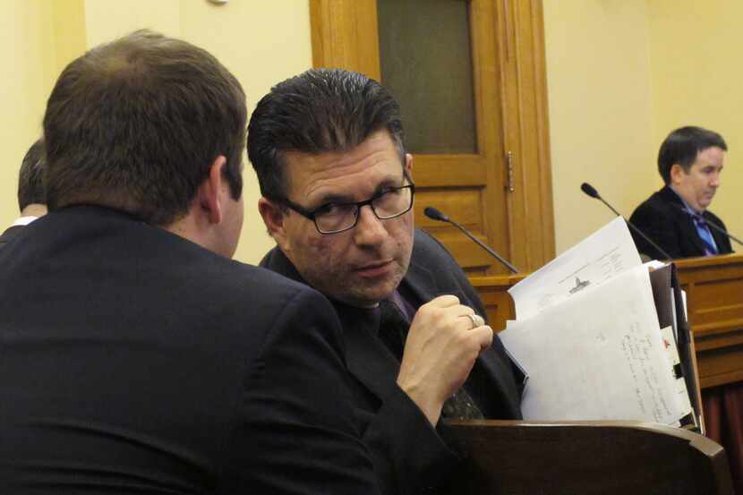Kansas state Rep. Jim Howell, right, a Derby Republican, speaks to John Commerford, left, a...