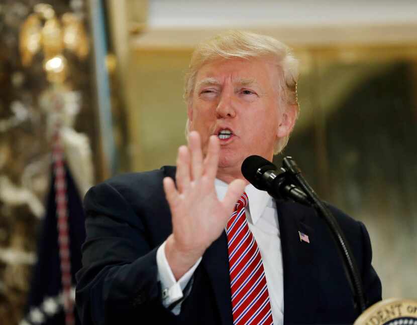 President Donald Trump speaks to the media in the lobby of Trump Tower in New York, Tuesday,...