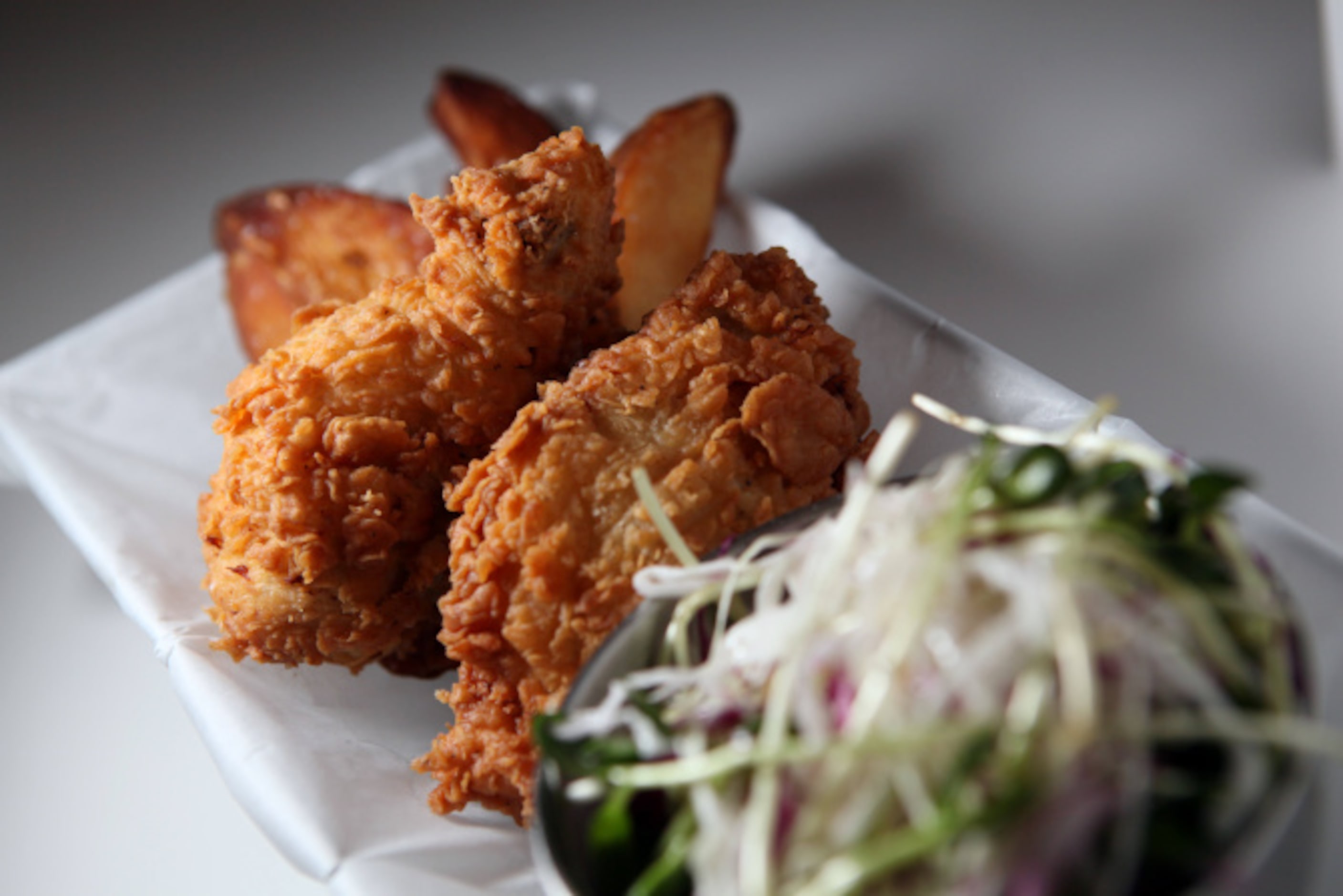 Fried chicken, served with sunflower slaw and fries, from The Front Room: A Park Cities Diner