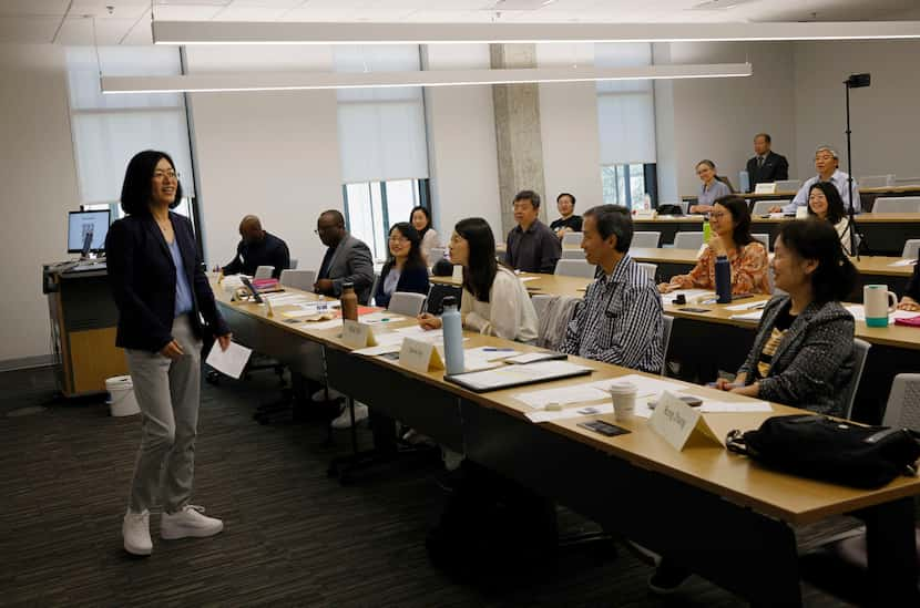 Jessica Wang, left, speaks during a meeting of Texas Dragon Toastmasters Club at the...