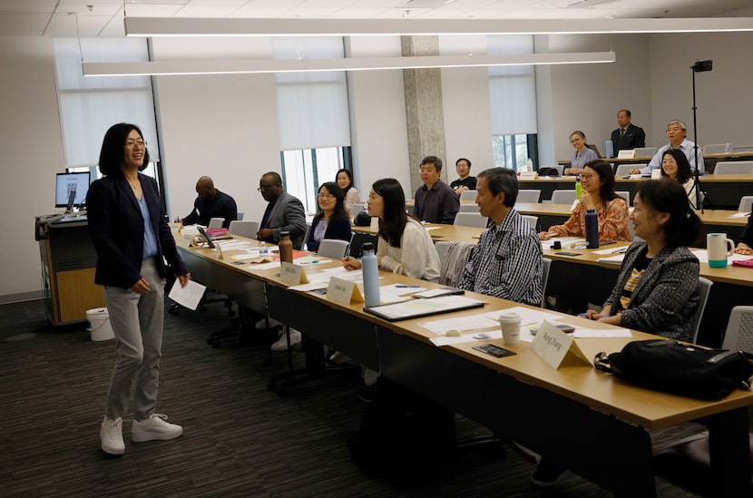 Jessica Wang, left, speaks during a meeting of Texas Dragon Toastmasters Club at the...