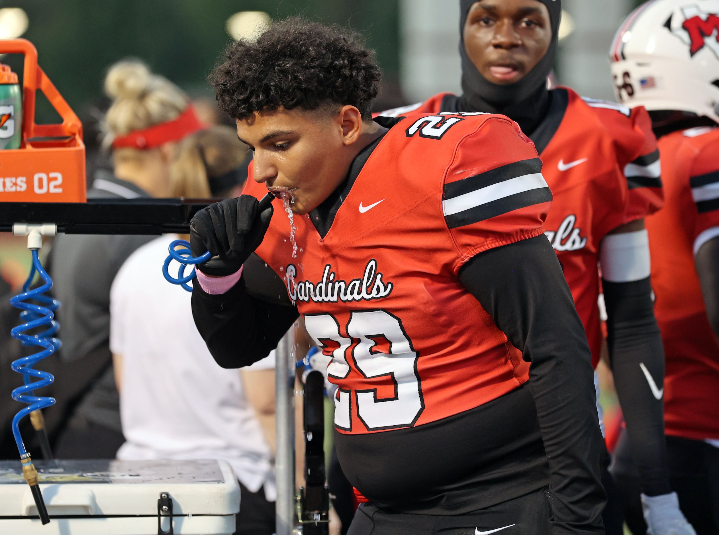 Irving MacArthur High’s Xavier Duran (29) takes a drink or water during the first half of a...