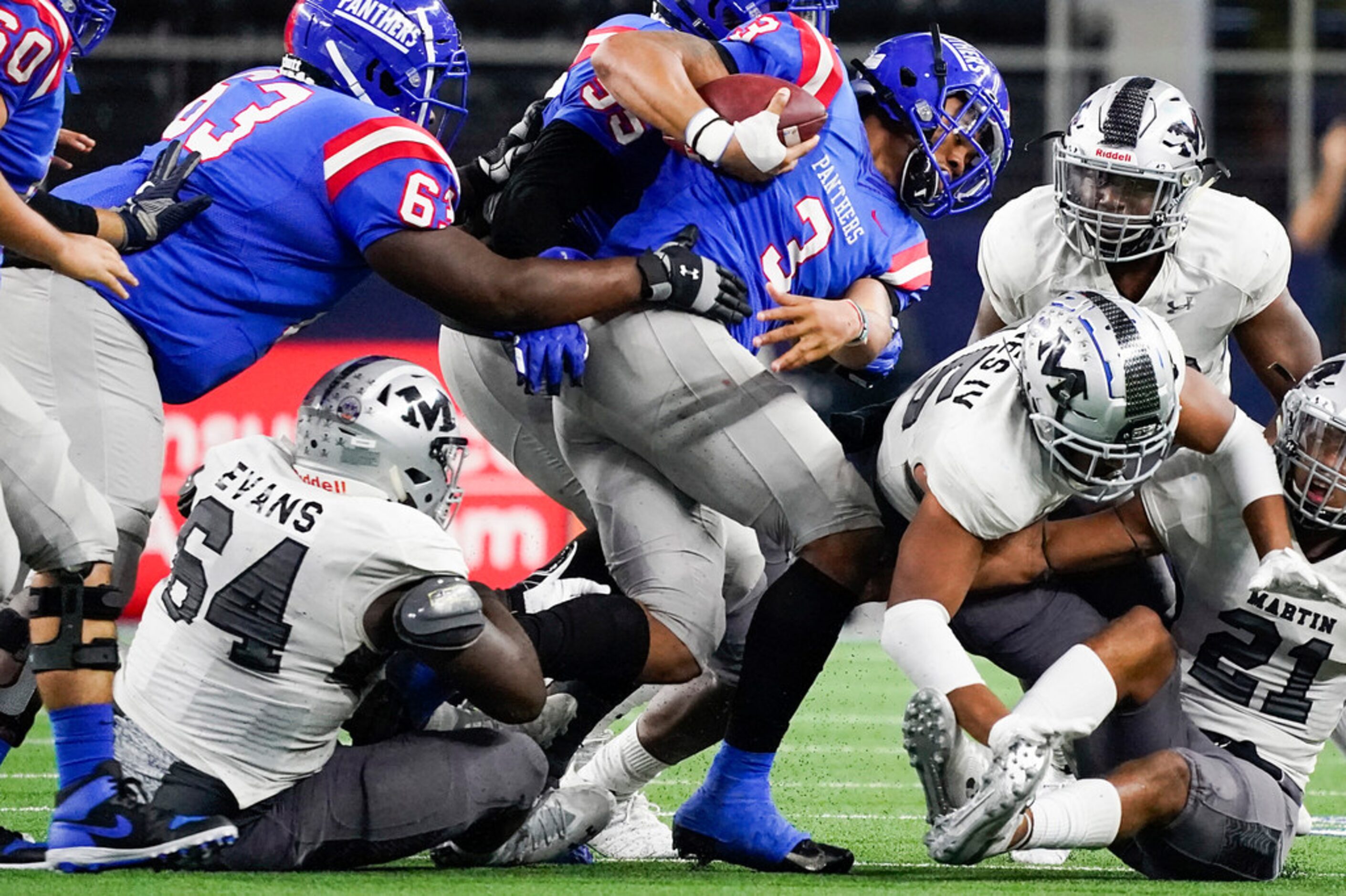 Duncanville quarterback JaÃQuinden Jackson (3)  is brought down by the Arlington Martin...