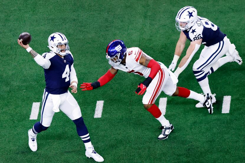 Dallas Cowboys quarterback Dak Prescott (4) makes a first quarter throw as he’s pressured by...