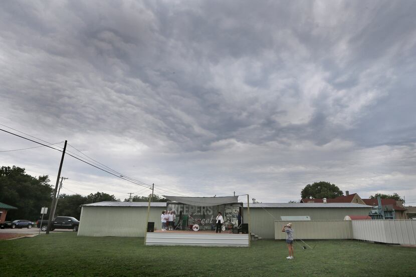 In this June 14, 2014 photo, a group performs to a near-empty field during a fair in Dublin,...