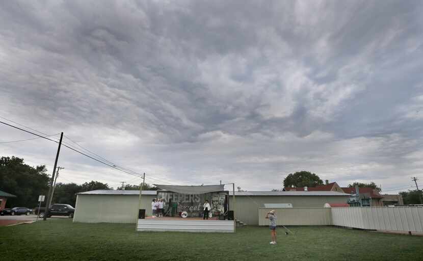 In this June 14, 2014 photo, a group performs to a near-empty field during a fair in Dublin,...