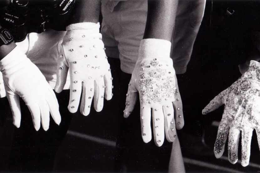 ORG XMIT: *S0424358341* July 13, 1984 - These four hands, covered with white gloves, belong...