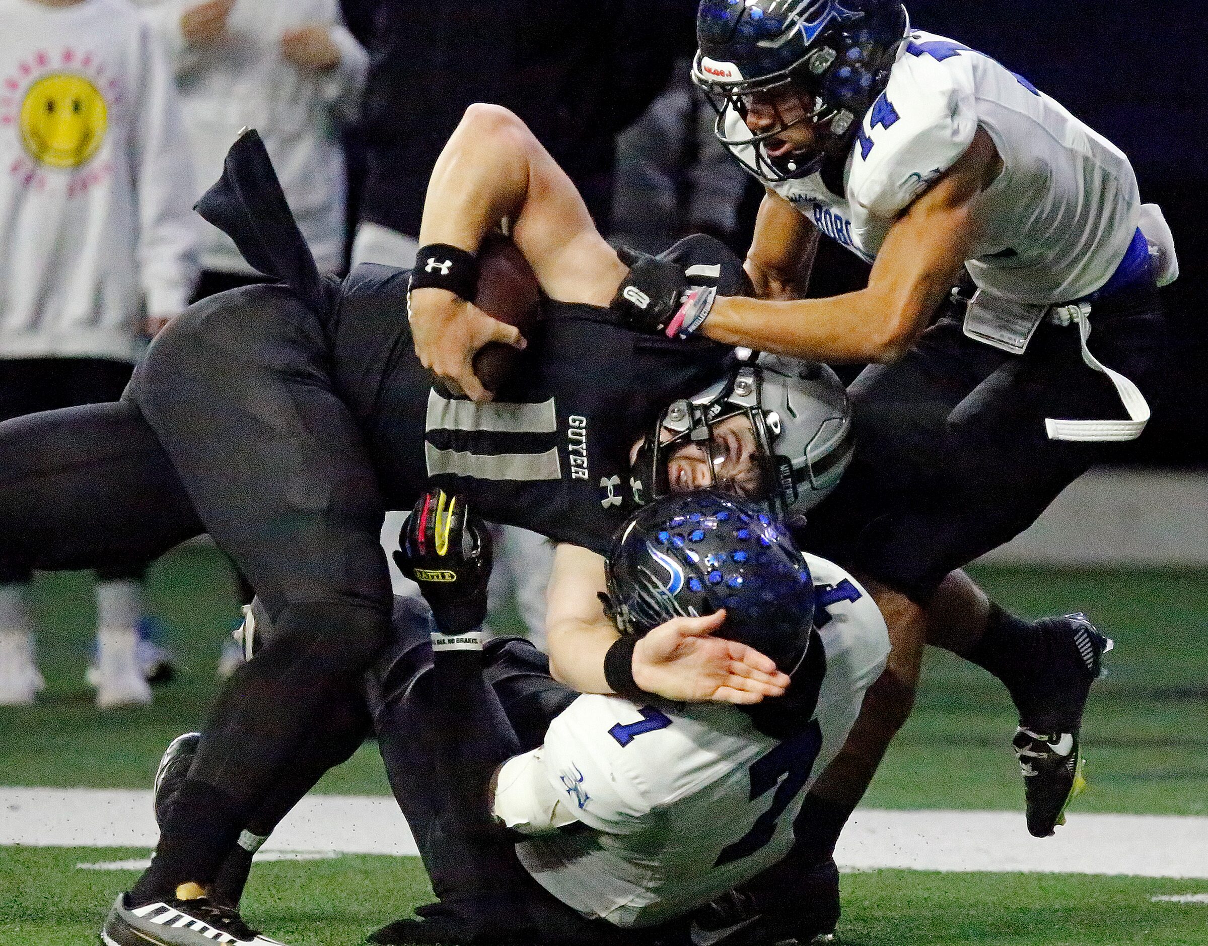 Guyer High School quarterback Jackson Arnold (11) is tackled by Byron Nelson High School...