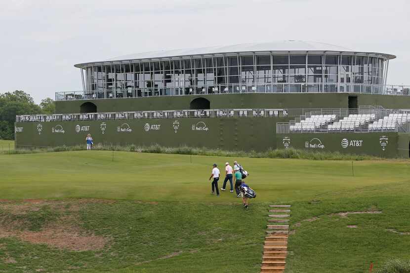 Pro golfers walked past Club 360 on Tuesday before the Byron Nelson tournament begins later...