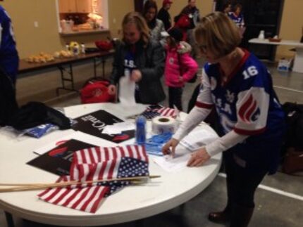  Ted Cruz supporters wrap up a festive debate watch party on Thursday at a church gymnasium...