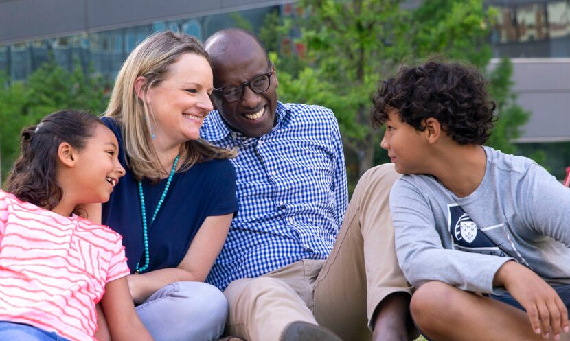 Amos Disasa (center right), senior pastor at First Presbyterian Church of Dallas, and his...