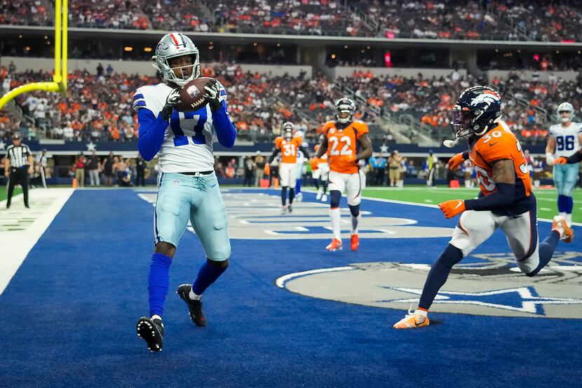 Dallas Cowboys wide receiver Malik Turner (17) catches a touchdown pass as Denver Broncos...