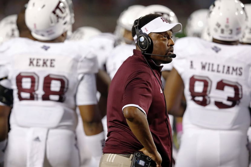 FILE - In this Oct. 24, 2015, file photo, Texas A&M coach Kevin Sumlin looks at the...