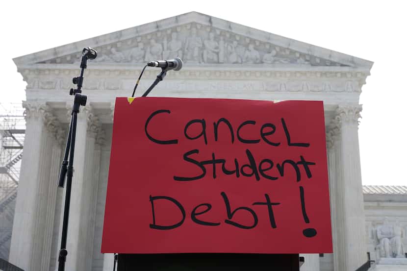 A sign reading "cancel student debt" is seen outside the Supreme Court, Friday, June 30,...