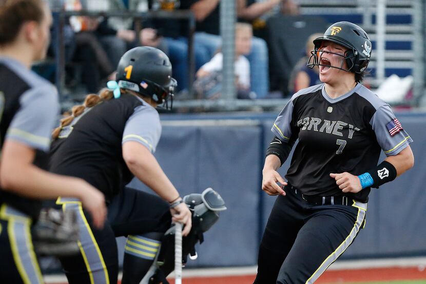 Forney second baseman Trinity Cannon (7) screams upon returning the dougout after scoring a...