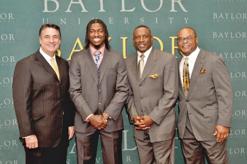 Neal Jeffrey (left), Robert Griffin III, Tim Brown and Mike Singletary attended the recent...