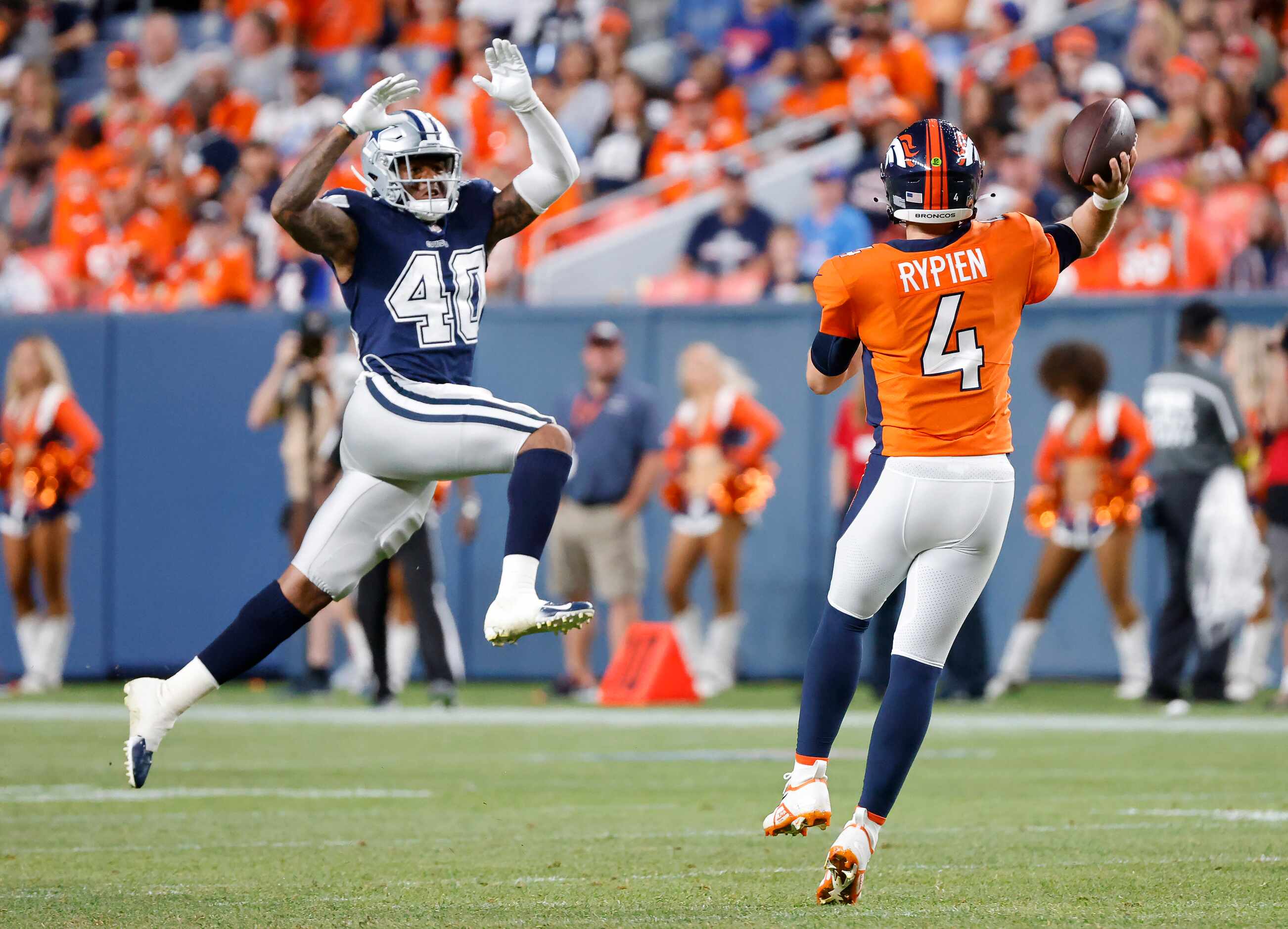 Dallas Cowboys safety Juanyeh Thomas (40) makes a leaping stab at a pass by Denver Broncos...