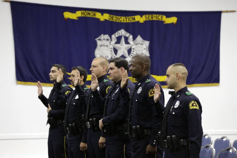 Dallas police officers were sworn in during their graduation ceremony at the Dallas Police...