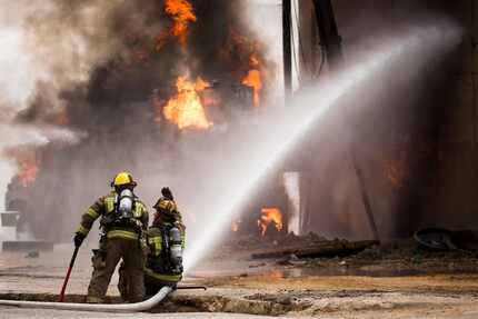 Dallas Fire Rescue responds to the scene of a fire on Friday, March 10, 2017, in Dallas....