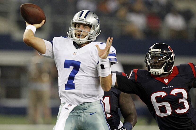 Dallas Cowboys quarterback Alex Tanney (7) throws  a pass as he is  chased by Houston Texans...