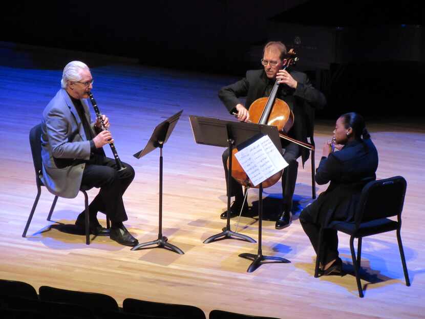 Paul Garner (clarinet), Jolyon Pegis (cello) and Ebonee Thomas (flute) perform in a Voices...