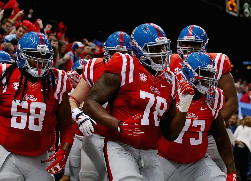 NEW ORLEANS, LA - JANUARY 01:  Laremy Tunsil #78 of the Mississippi Rebels celebrate his...