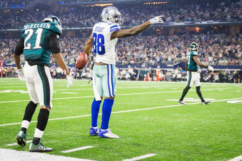 Dallas Cowboys wide receiver Dez Bryant (88) signals the first down after hauling in a...