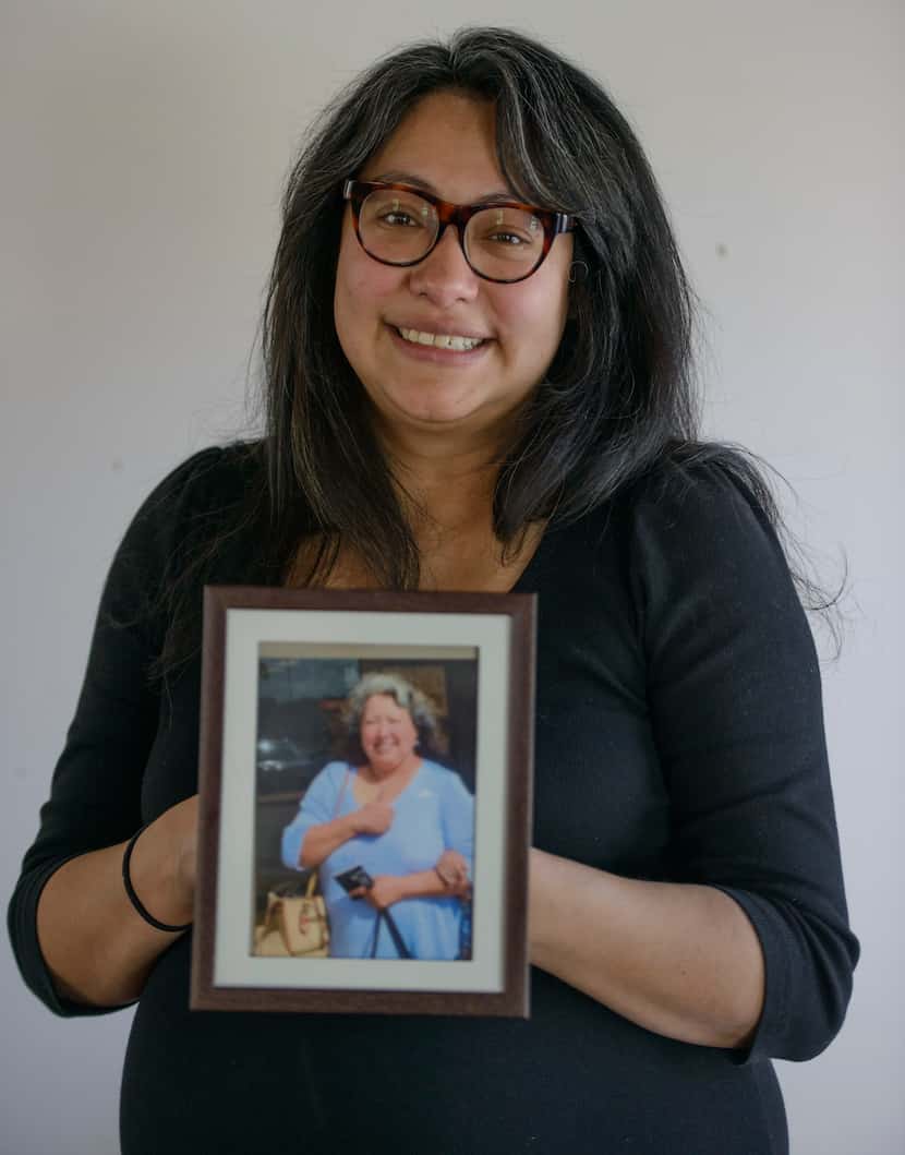 Dee Lara O'Neal holds a photo of her late mother, Patricia Muñoz.