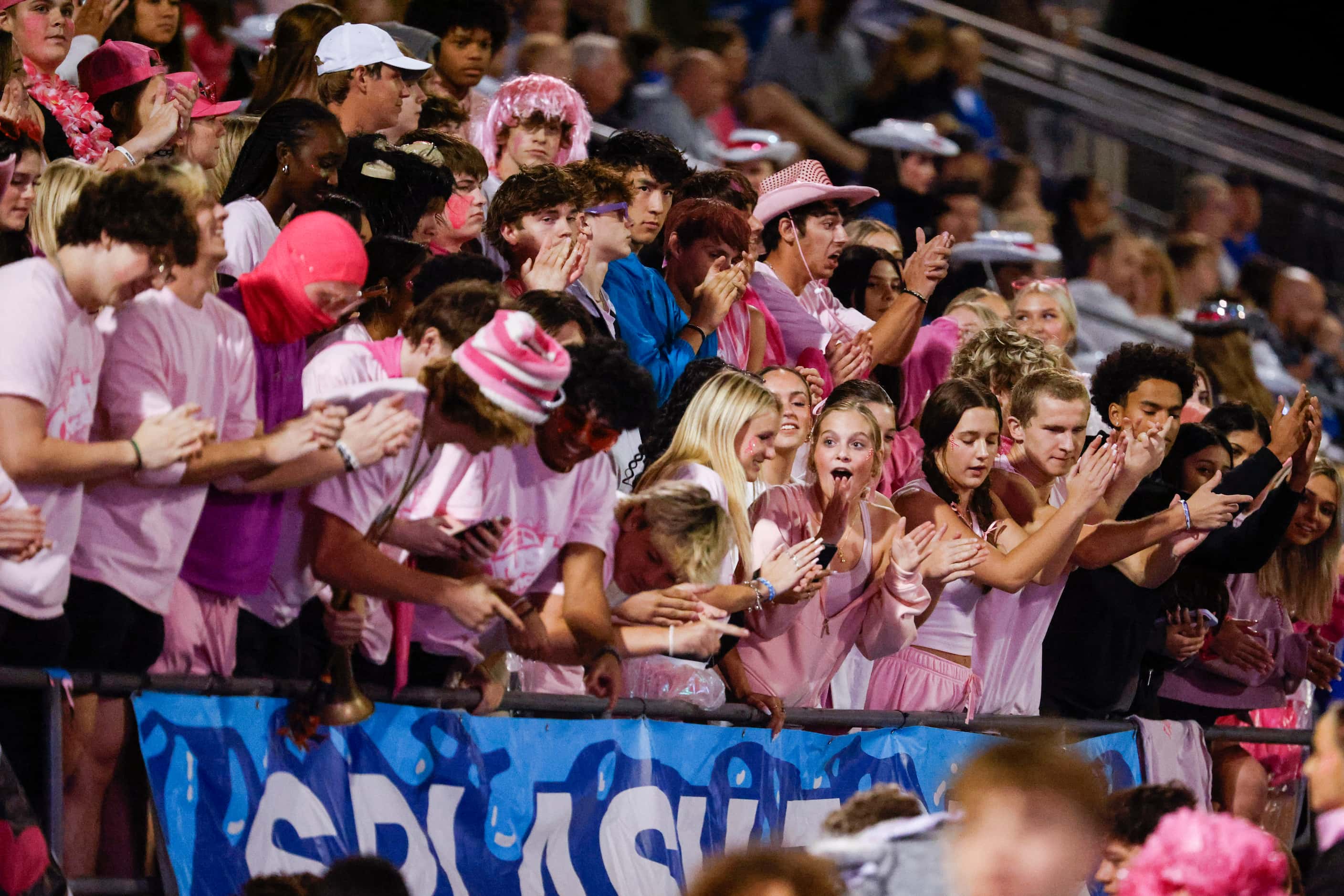 Byron Nelson high student section cheer during the second half of a football game against...