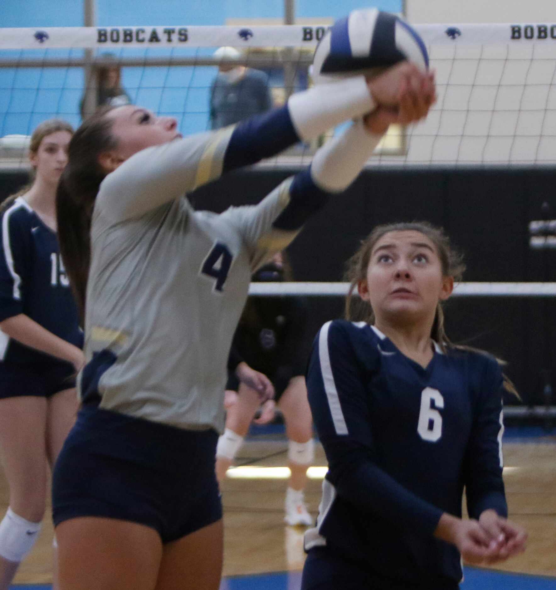 Keller's Sydney Gholson (4) reaches to deliver a return in front of teammate Kea Whillock...