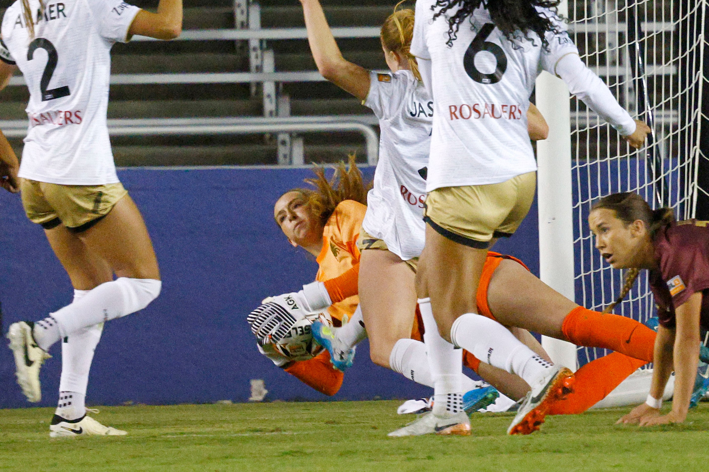 Dallas Trinity goalkeeper Madison White makes a save Spokane Zephyr FC players during the...